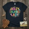 Crazy Horse Lady text design with colorful letters, horseshoe, and small horse graphics on a navy t-shirt