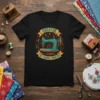 Creator of Fabric Worlds t-shirt with a teal vintage sewing machine, stars, and moons graphic