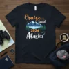 Cruise Squad 2024 Alaska text design with mountains, waterfall, and orcas on a navy t-shirt