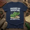 Crushed By Adventure Big Shoes To Fill t-shirt design featuring a person overwhelmed by a giant green shoe