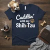 Cuddlin' with my Shih Tzu text design on a navy t-shirt, featuring a paw print and heart graphic