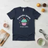 Navy t-shirt with "Cupcake ipsum Lorem Dolor" text and a cartoon cupcake graphic featuring swirled frosting and a cherry