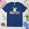 Cute Bunny Nurse T-Shirt featuring a cartoon bunny wearing scrubs and a stethoscope with the word NURSE in colorful letters