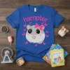 Blue t-shirt with "hamper" text and a cute gray hamster with a pink bow, surrounded by pink butterflies