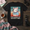 CUTE HOODIE CAT AESTHETIC VIBES text on a black t-shirt featuring a kawaii cat in a blue hoodie