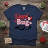 Navy blue t-shirt with "Love Bug" text in red and pink, featuring a cute ladybug graphic and hearts