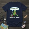 Pediatric Nurse t-shirt with a cartoon pickle character holding a syringe and teddy bear, wearing a nurse hat