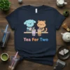 Cute dog and cat characters making bubble tea with "Tea For Two" text, navy t-shirt design