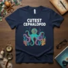 Cutest Cephalopod text with a cartoon octopus wearing a diving helmet and surrounded by coral graphic on a navy t-shirt
