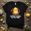 Cutest Chick in the Yard t-shirt design with a baby yellow chick in a nest, surrounded by red hearts and