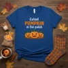 Cutest Pumpkin in the patch text with three smiling jack-o'-lanterns graphic on a blue t-shirt