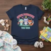 Cutie Patootie The Trio t-shirt featuring a cartoon lamb, bear, and fox with colorful flowers and text