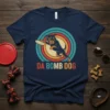 Da Bomb Dog text with a Rottweiler wearing sunglasses catching a frisbee, vintage retro sunset circle design