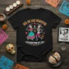 Día de los Muertos Celebration of Life t-shirt with dancing skeleton couple in festive attire and floral accents