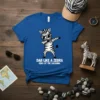 Dab Like A Zebra King Of The Savanna text on a blue t-shirt with a dabbing zebra graphic and sunglasses