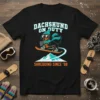Dachshund on a snowboard wearing sunglasses and scarf, text Dachshund On Duty Shredding Since '98 on black t-shirt