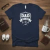 DAD EST. 2017 t-shirt design featuring shield graphic with hands shaking inside and banner, navy blue shirt