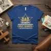 Blue t-shirt with "Dad Grandpa Great Grandpa I Just Keep Getting Better" text in yellow star graphic