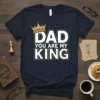 Navy blue t-shirt with white text "DAD YOU ARE MY KING" and a gold crown graphic above