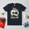 Dadacorn t-shirt design featuring a tattooed unicorn dad with sunglasses and a baby unicorn on his shoulder