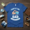 Daddy of Two Like a Regular Dad Just Twice as Cool blue t-shirt design with flexing arm graphic and festive