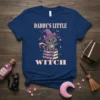 Daddy's Little Witch t-shirt design with a cute gray witch cat sitting on books, wearing a witch hat. Features pink