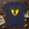 Navy blue t-shirt with "DADMAN" in yellow varsity font above a yellow shield containing a silhouette of a father in