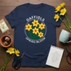 Navy t-shirt featuring white text "DAFFIDLS SPRING BLOOM" surrounding a circle of yellow daffodils and green leaves graphic