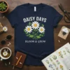 Daisy Days Bloom & Grow quote with a bouquet of white daisies on a navy t-shirt