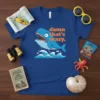 Damn That's Crazy text with a surprised whale graphic on a blue t-shirt, featuring ocean waves