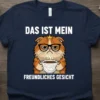 Das Ist Mein Freundliches Gesicht German t-shirt design with a grumpy Persian cat holding a coffee cup and wearing glasses