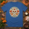 Day of the Dead Fiesta t-shirt design with sugar skull, flowers, and pumpkins, text reads "Day of the Dead Fiesta