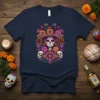 Day of the Dead Skull T-Shirt design featuring a colorful sugar skull with floral headdress and surrounding flowers