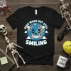 Dead Inside But Still Smiling Earth T-Shirt with a spooky smiling planet graphic and text