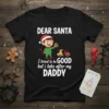 Dear Santa I Tried to be GOOD but I take after my DADDY text on a black t-shirt with a