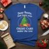 Blue t-shirt with "Dear Santa, Just leave your CREDIT CARD under the tree" text and a Christmas tree with gifts