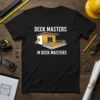Black t-shirt with "DECK MASTERS M DECK MASTERS" text and a deck graphic