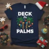 Deck the Palms Christmas T-Shirt design featuring two palm trees decorated with Christmas lights and ornaments
