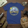 Deer Valley t-shirt with a circular graphic of mountains, a deer, and pine trees under a sun
