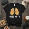 Black t-shirt with "DEEZ NUTS" text and two cartoon peanuts giving a fist bump