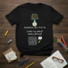 Black t-shirt with "DEFINITELY THE TYPE TO Lose my pencil every period" quote, creativity potion graphic, and maze illustration