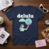 Delulu graphic t-shirt with text "delulu", a girl holding a bubble with a castle and unicorn, and a cloud