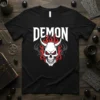 Black t-shirt with white "DEMON" text above a white skull with red eyes and horns, surrounded by red and grey