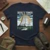 Devil's Tower First National Monument graphic tee with vintage landscape illustration and text