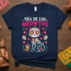 Día de los Meowtos t-shirt design featuring a colorful cat skeleton with sugar skull face, surrounded by flowers and small