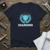DIAMOND text with a bright blue gemstone surrounded by a laurel wreath on a navy t-shirt