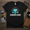 Black t-shirt with white text "DIAMOND HANDS" below a turquoise diamond inside a lotus outline