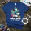 Diamond Painting Is My Therapy t-shirt with skeleton artist painting a butterfly, blue mountains background