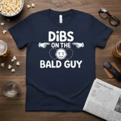Navy t-shirt with white text "DiBS ON THE BALD GUY" and graphics, featuring pointing fingers and a smiling bald head