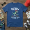 Dino Crew Stay Sharp Skate Fast t-shirt design featuring a cartoon dinosaur skateboarding and text